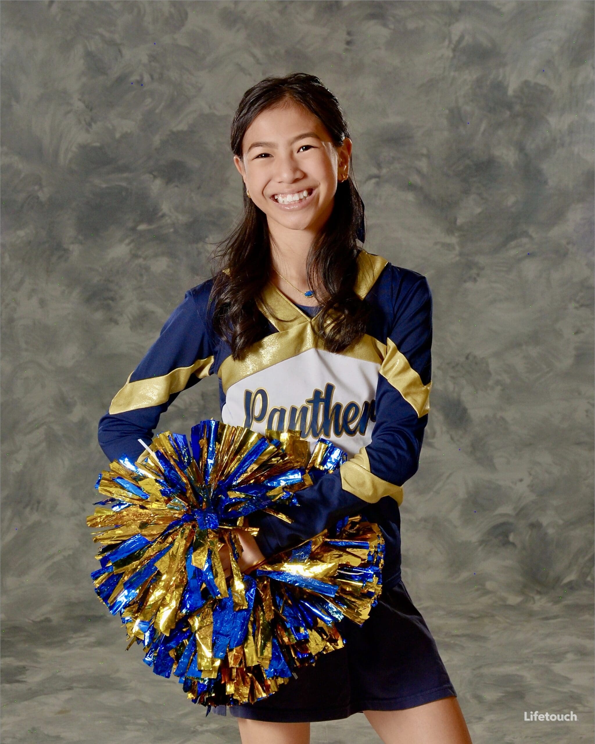 Roselyn in school sideline cheer uniform balancing cheerleading with her other activities