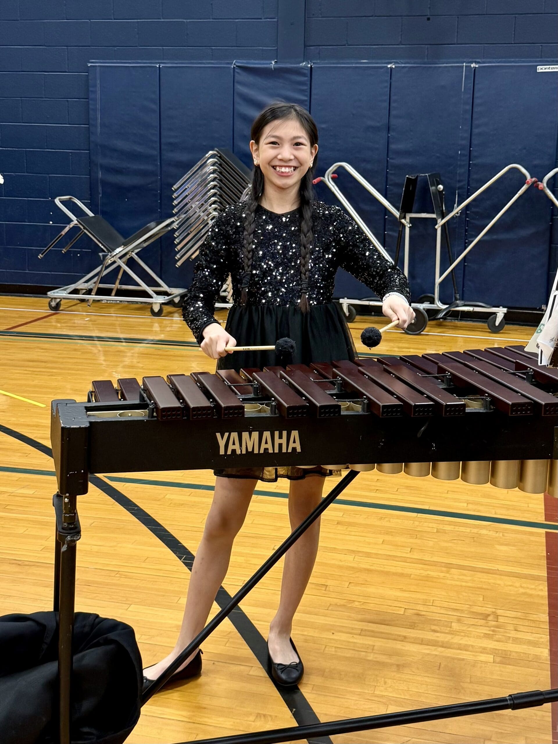 Roselyn playing percussion in concert band balancing music and athletics